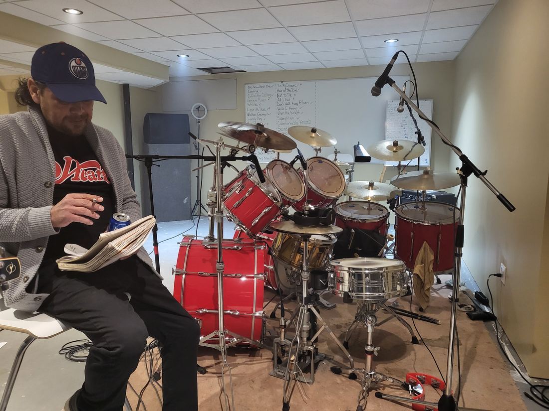John McGillis reviewing charts at Corduroy Fields rehearsal, Premier kit in background