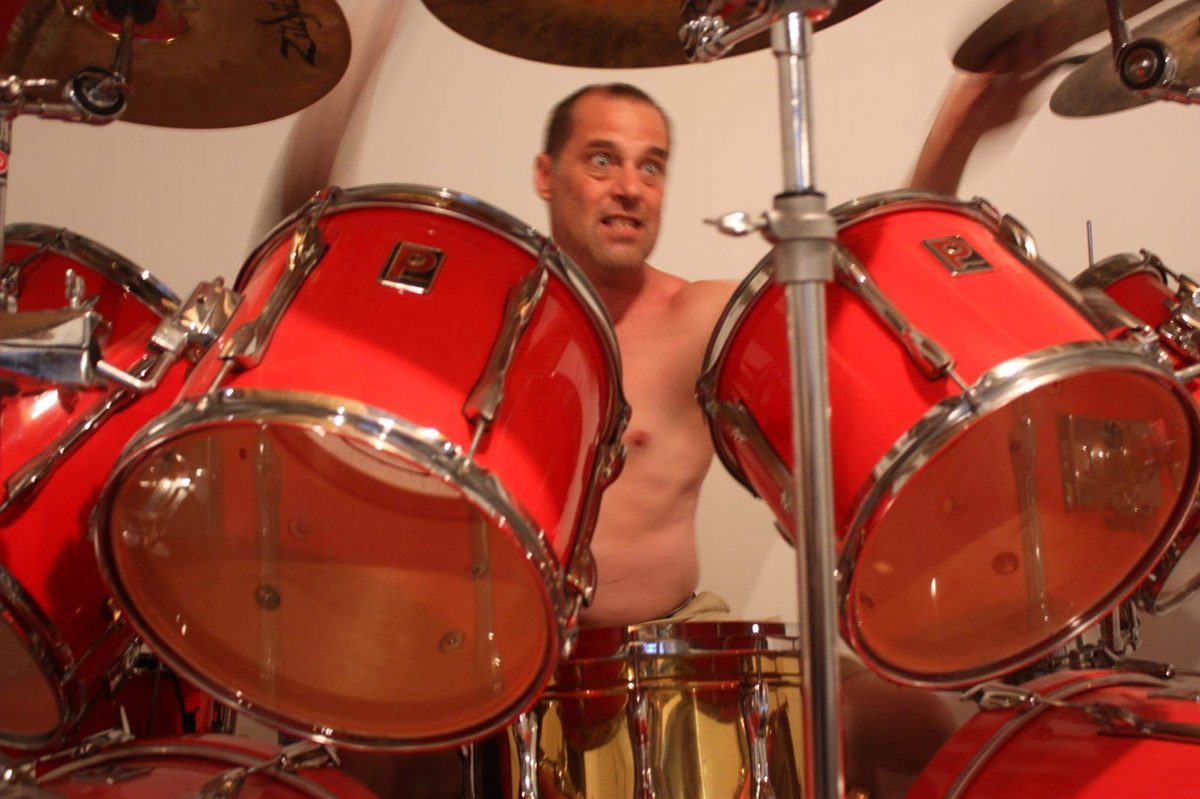 Joel Davies behind his Premier Inferno Red double-bass kit